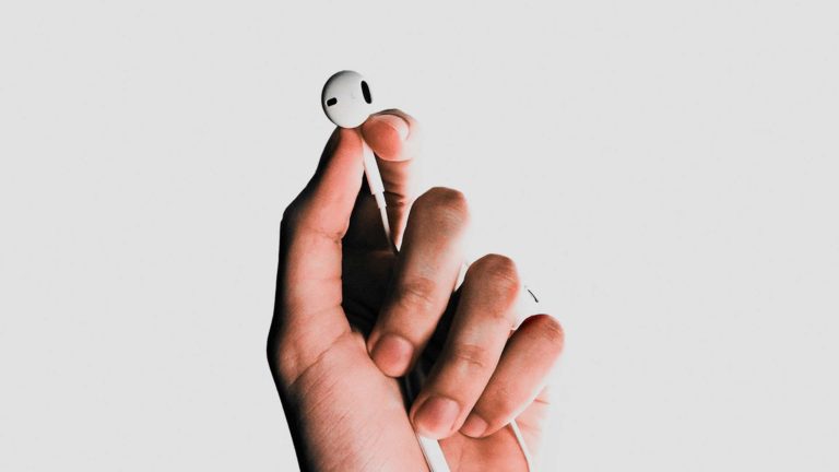Hand holding earbud