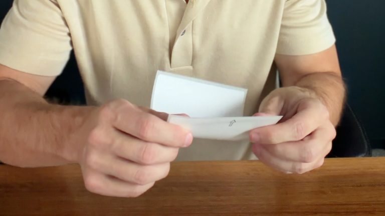 Close up of Kyle's hands holding a label